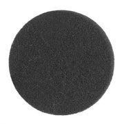 Black round cleaning sponge for effective scrubbing and surface maintenance.