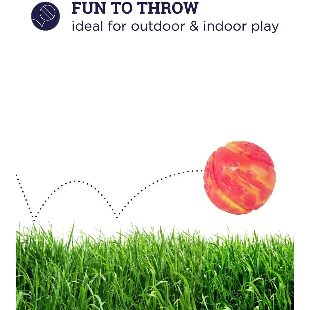 Colorful throw ball bouncing in grass, perfect for indoor and outdoor play.