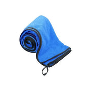 Blue microfiber towel rolled up, perfect for quick drying and travel convenience.