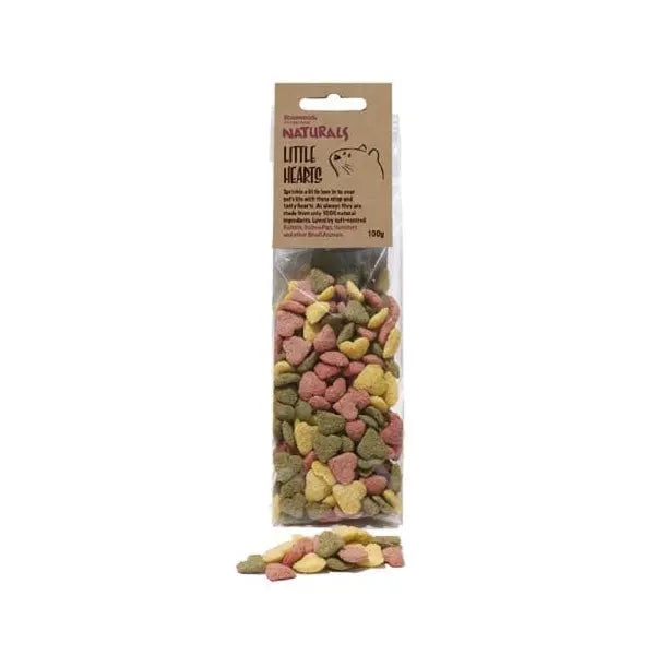 Colorful heart-shaped pet food in a clear bag, featuring a natural ingredients label.