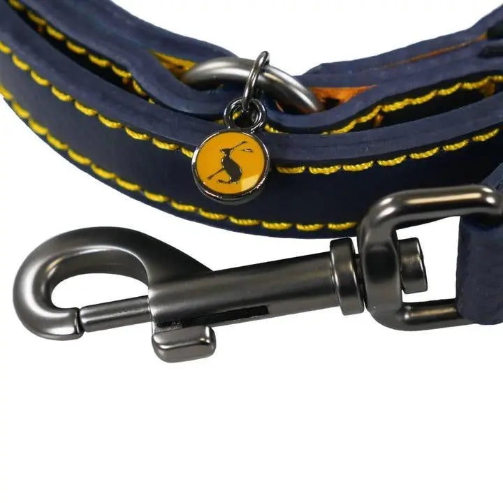 Navy dog leash with yellow stitching and a secure metal clip for safe walks.