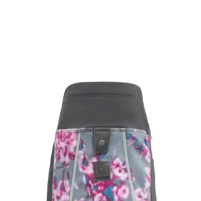 Floral-patterned fleece dog jacket with a sleek black top for warmth and style.