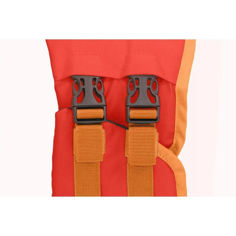 Red harness with adjustable straps and secure buckles for pet safety.
