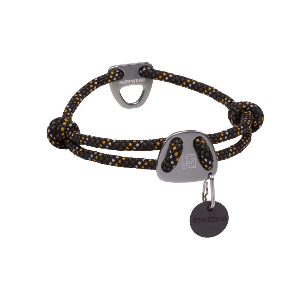 Durable black and yellow dog collar with adjustable design and metal tag for identification.