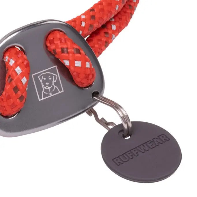 Durable red dog leash with a metal clip and Ruffwear tag for secure outdoor adventures.