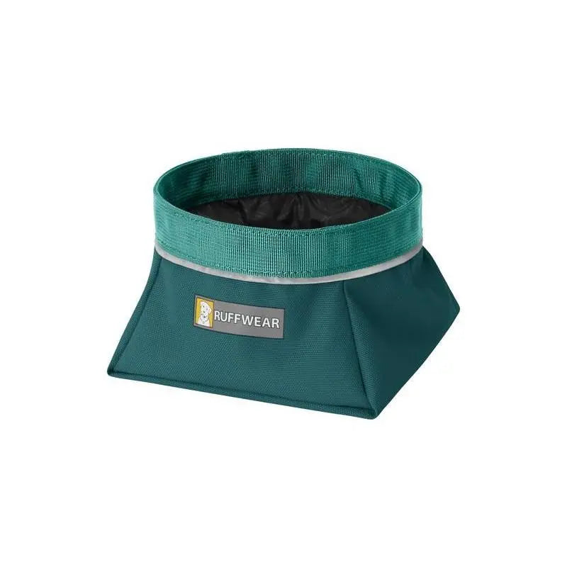 Collapsible dog bowl in teal, perfect for travel and outdoor adventures.
