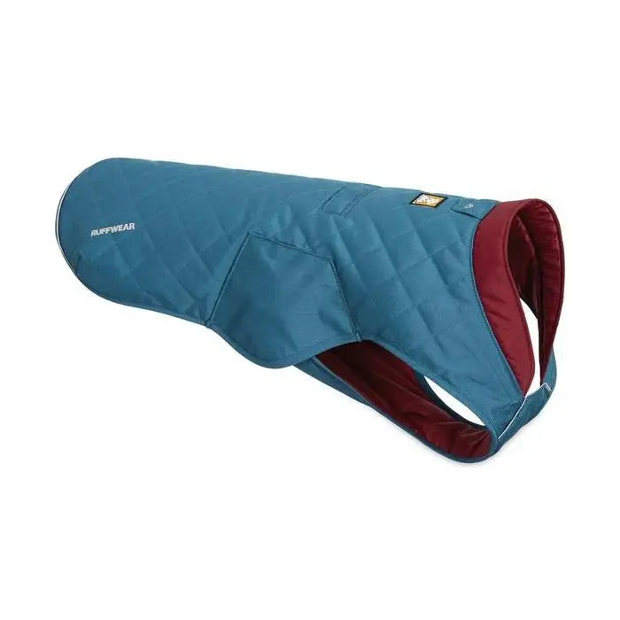 Dog jacket in teal with a quilted design, perfect for keeping pets warm and stylish.