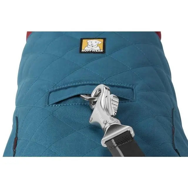 Dog harness with a secure clip and pocket for easy leash attachment and storage.