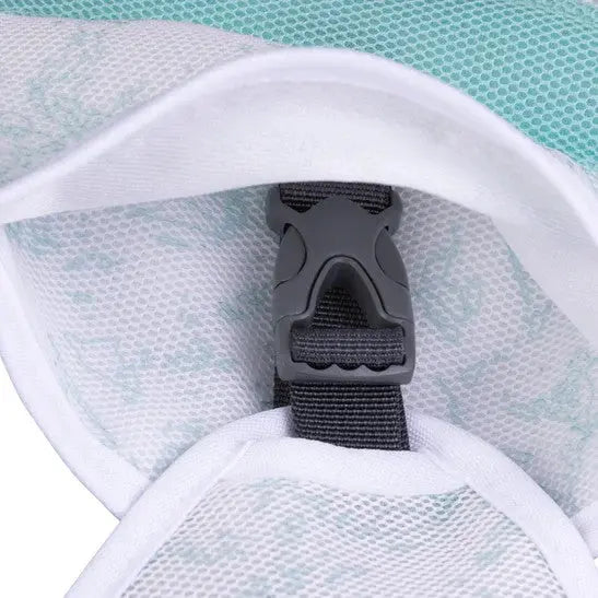Close-up of a secure buckle on a breathable mesh fabric, ideal for outdoor gear.