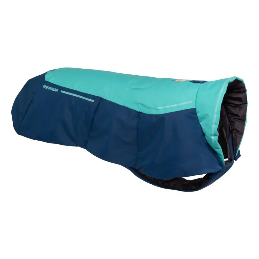 Dog jacket in teal and navy, designed for warmth and comfort during outdoor activities.