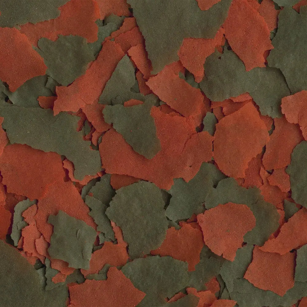 Colorful textured paper scraps in red and green, ideal for arts and crafts projects.