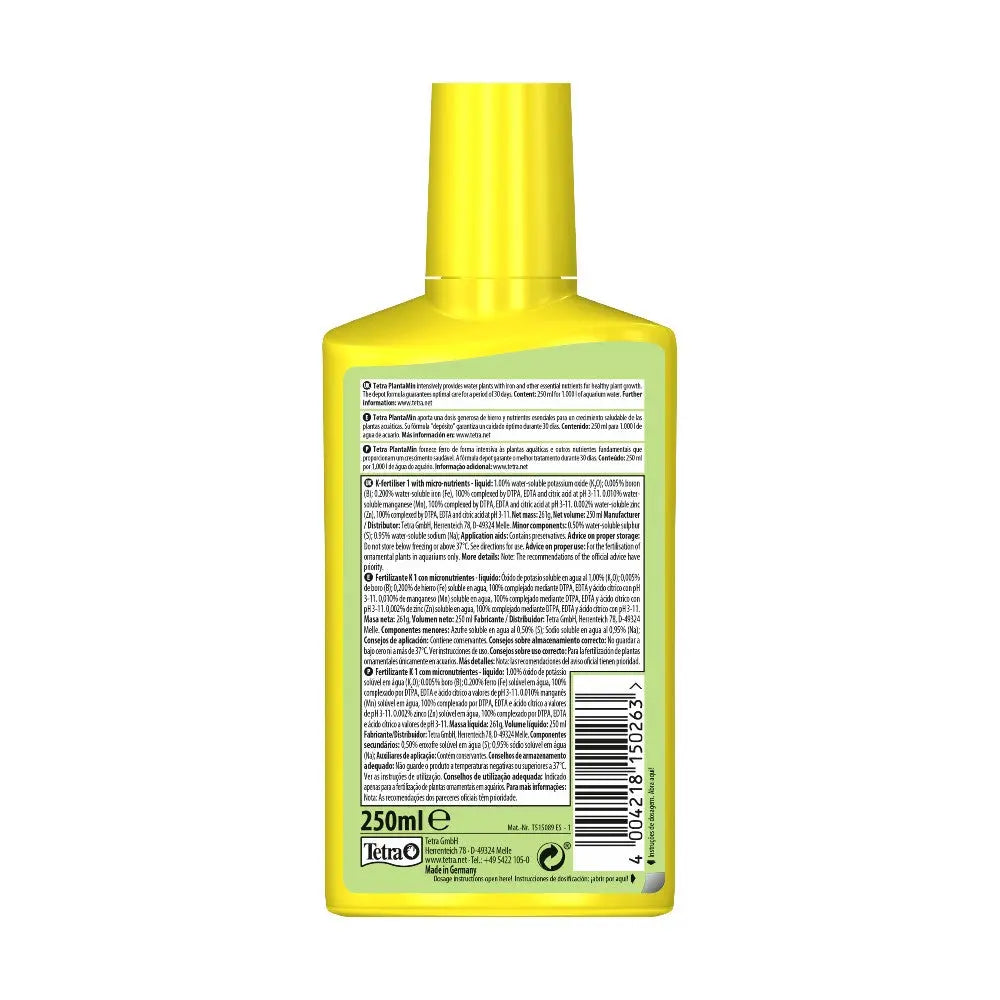 Yellow bottle of liquid product with detailed ingredient label and usage instructions on the back.