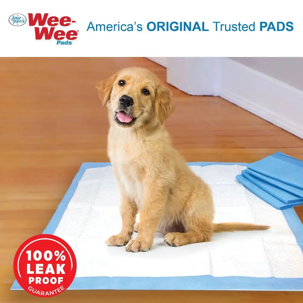 Golden retriever puppy on a Wee-Wee pad, showcasing its leak-proof design for pet training.