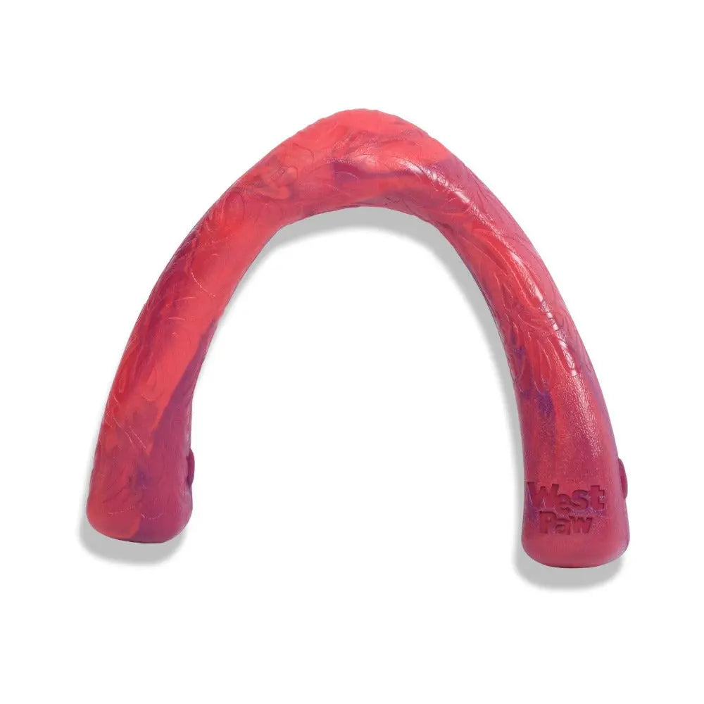 Durable West Paw dog chew toy in vibrant red, perfect for interactive play and dental health.