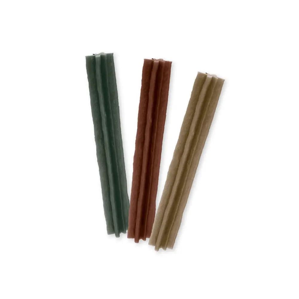 Natural dog chews in green, brown, and beige for healthy pet treats and dental care.
